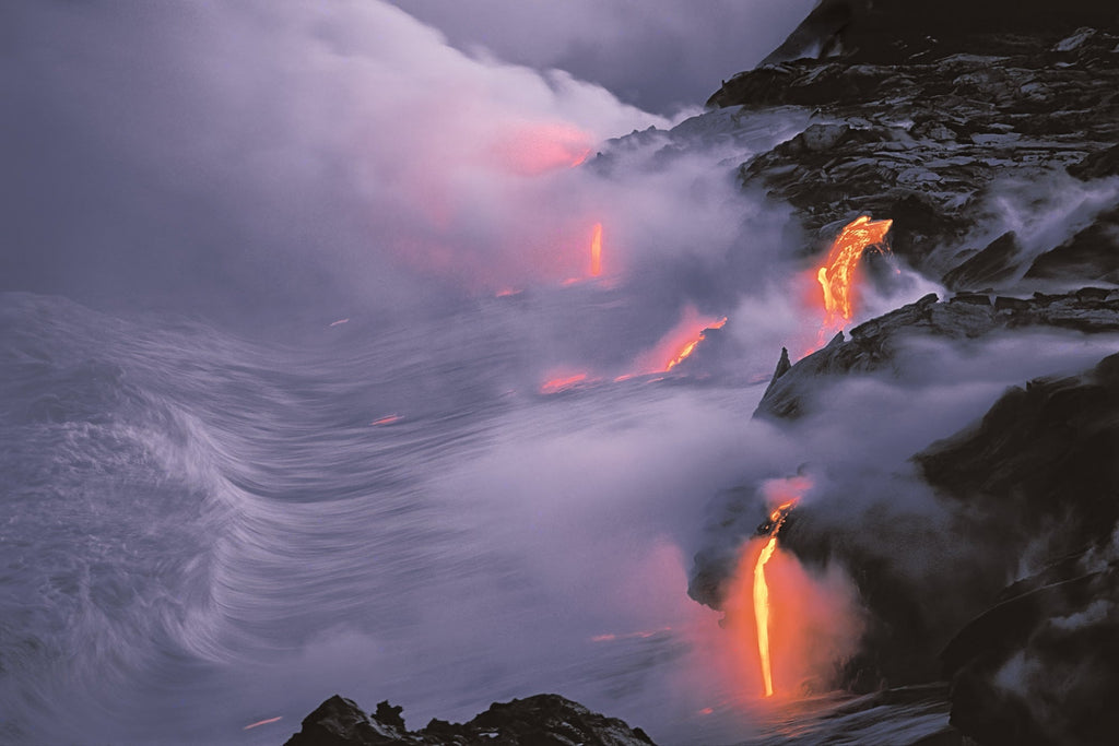 Lava flow entering the sea at twilight, Hawaii Volcanoes National Park, Hawaii 1994